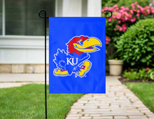 Load image into Gallery viewer, blue university of Kansas garden flag hung outside from a black garden flag stand
