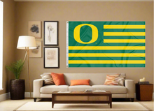 Load image into Gallery viewer, University Of Oregon National 3x5 Flag with seven green stripes and six gold stripes hung indoors behind sofa
