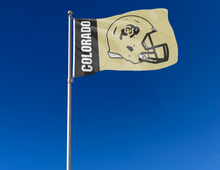 Load image into Gallery viewer, 3x5 feet wide Black and gold 2 panel University of colorado football flag with two metal grommets attached to flagpole waving in the wind
