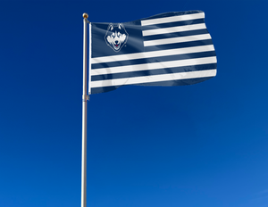 3x5 foot wide University of Connecticut (UCONN) National Flag with seven navy stripes 6 white stripes and two metal grommets attached to flagpole waving in the wind