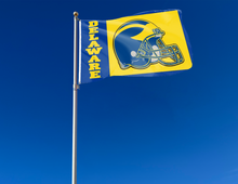 Load image into Gallery viewer, Blue 3x5 foot wide University of Delaware flag with football logo inside gold square and two metal grommets attached to flagpole waving in the wind
