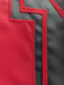 Red N logo sewn onto black three by five foot University of Nebraska Applique flag with two metal grommets