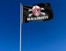 Load image into Gallery viewer, Black 3x5 University of Nebraska Flag with New Nebraska Blackshirts Logo and two metal grommets attached to flagpole waving in the wind
