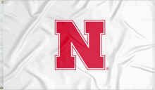 Load image into Gallery viewer, White three by five foot wide University of Nebraska Lincoln Applique flag with two metal grommets for indoor home decor or outdoor home decor
