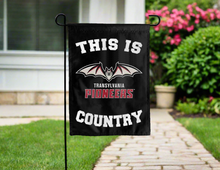 Load image into Gallery viewer, black double sided garden flag with this is transylvania pioneers country logo for yard decor
