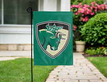 Load image into Gallery viewer, green garden flag with usf shield logo hung outside for yard decor
