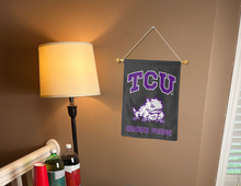 Load image into Gallery viewer, black tcu horned frogs garden flag hung inside a well lit college dorm
