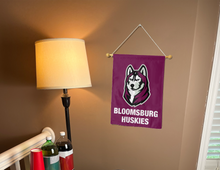 Load image into Gallery viewer, bloomsburg huskies garden flag for college dorm decor hung inside a college dorm
