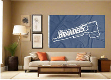 Load image into Gallery viewer, indoor display of blue brandeis judges athletics flag for man cave decor
