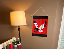 Load image into Gallery viewer, eastern washington garden flag with ewu logo hung inside a college dorm
