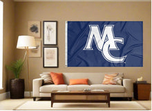 Load image into Gallery viewer, indoor display of blue marietta college flag with mc logo for man cave decor
