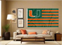 Load image into Gallery viewer, indoor display of miami hurricanes flag with seven green and six orange stripes as part of man cave decor
