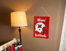 Load image into Gallery viewer, miami ohio football garden flag hung inside a college dorm for dorm decor
