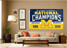 Load image into Gallery viewer, indoor display of Michigan Basketball 2-Time March Madness Champions Flag for man cave decor
