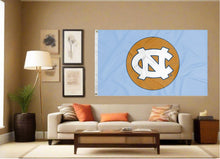 Load image into Gallery viewer, indoor display of blue north carolina basketball flag for man cave decor
