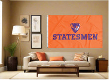 Load image into Gallery viewer, outdoor display of orange hobart flag with statesmen logo for man cave decor
