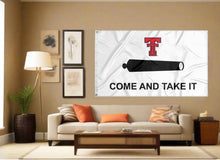 Load image into Gallery viewer, indoor display of texas tech university flag with come and take it logo for man cave decor
