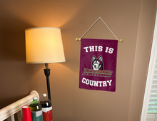 Load image into Gallery viewer, this is bloomsburg university country garden flag hung inside of a college dorm
