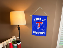 Load image into Gallery viewer, this is louisiana tech country garden flag hung inside for college dorm decor
