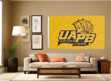 Load image into Gallery viewer, indoor display of uapb golden lions flag for man cave decor
