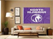 Load image into Gallery viewer, indoor display of purple university of north alabama flag for man cave decor
