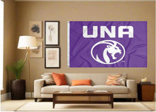 Load image into Gallery viewer, indoor display of purple university of north alabama flag with una lions logo for man cave decor
