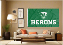 Load image into Gallery viewer, indoor display of green william smith flag with herons logo for man cave decor
