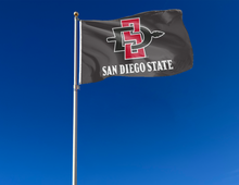 Load image into Gallery viewer, outdoor display of black san diego state aztecs flag for tailgate decor
