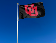 Load image into Gallery viewer, outdoor display of black university of utah flag with interlock uu logo for tailgate decor
