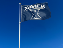 Load image into Gallery viewer, outdoor display of blue xavier university flag for tailgate decor
