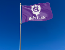 Load image into Gallery viewer, outdoor display of purple college of the holy cross flag for tailgate decor
