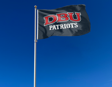 Load image into Gallery viewer, outdoor display of dallas baptist university flag with dbu patriots logo for tailgate decor
