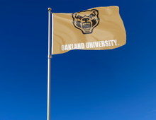 Load image into Gallery viewer, outdoor display of gold oakland university grizzlies flag for tailgate decor
