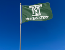 Load image into Gallery viewer, outdoor display of green montana tech flag for tailgate decor
