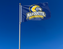 Load image into Gallery viewer, outdoor display of marquette golden eagles flag for tailgate decor
