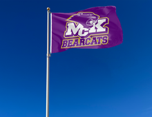 Load image into Gallery viewer, outdoor display of purple mckendree bearcats flag for tailgate decor
