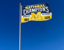 Load image into Gallery viewer, outdoor display of Michigan Basketball 2-Time March Madness Champions Flag for tailgate decor
