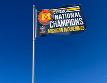 Load image into Gallery viewer, outdoor display of michigan wolverines basketball 2026 national champions 3x5 flag as part of tailgate decor
