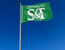 Load image into Gallery viewer, outdoor display of green missouri s&amp;t miners flag for tailgate decor
