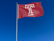 Load image into Gallery viewer, outdoor display of red temple university flag for tailgate decor
