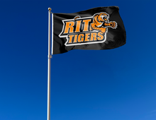 Load image into Gallery viewer, outdoor display of black rochester institute of technology flag with rit tigers logo for tailgate decor
