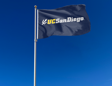 Load image into Gallery viewer, outdoor display of blue uc san diego tritons flag for tailgate decor
