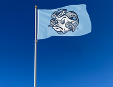 Load image into Gallery viewer, outdoor display of blue unc rameses flag for tailgate decor
